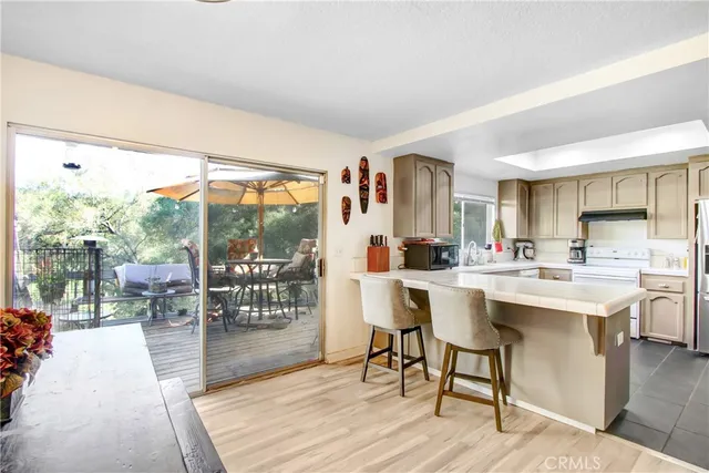 a view of a dining room with furniture window and outside view