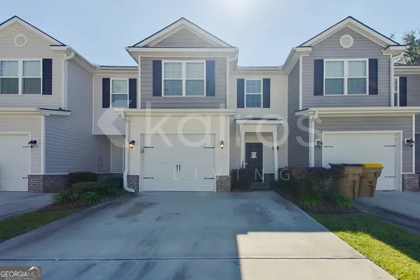 a front view of a house with yard