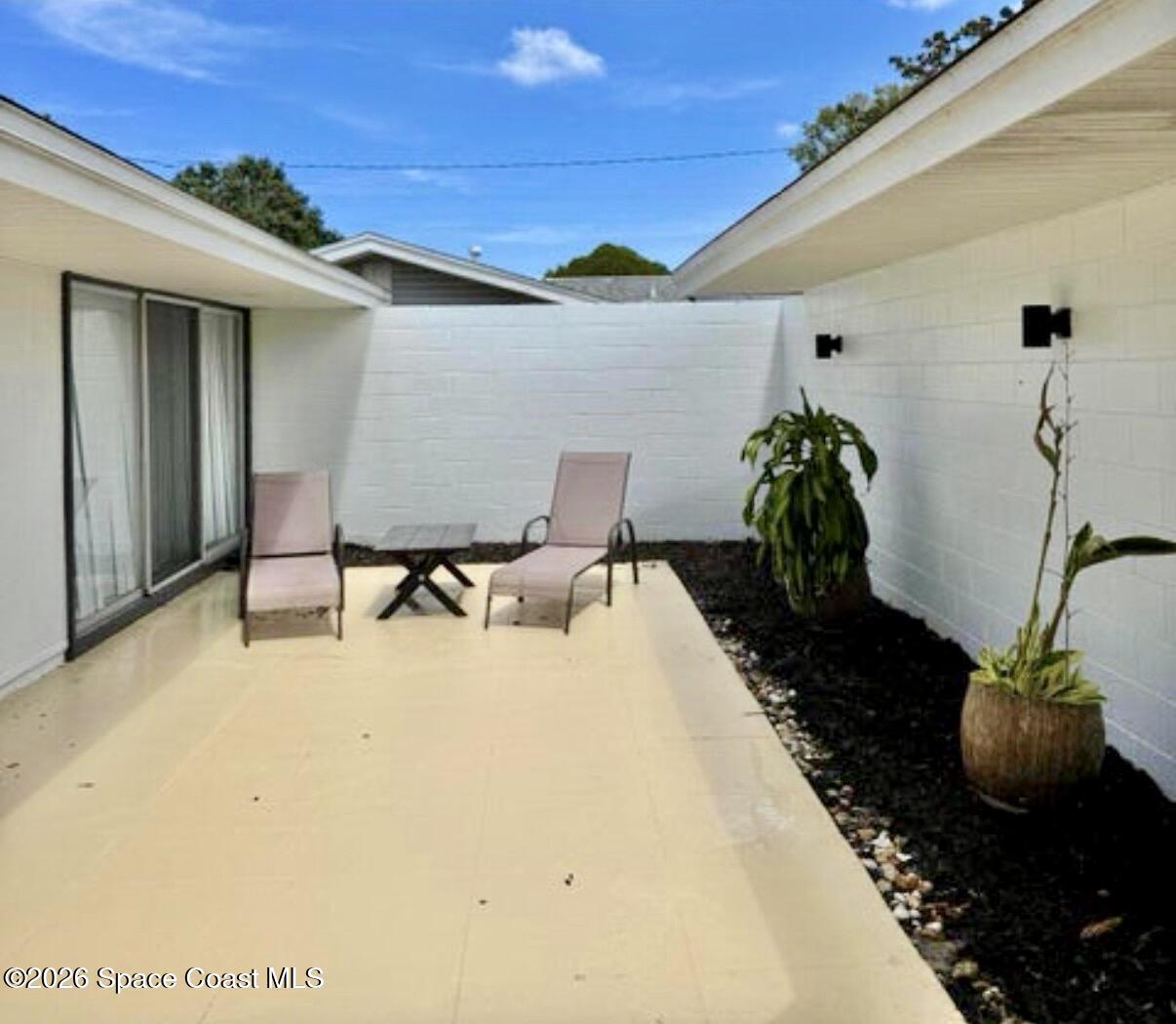 938 Brunswick Lane Rockledge, FL 32955 - Photo 11 of 21 Frnt courtyard off primary with furn.
