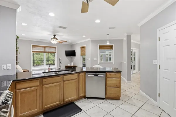 a kitchen with a sink and cabinets