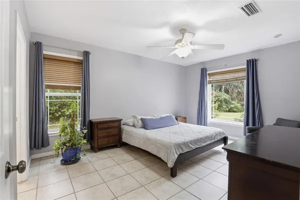 a bedroom with furniture and a window