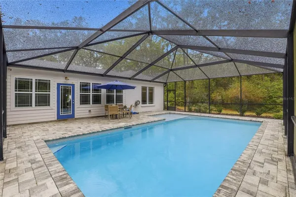 a view of a house with a swimming pool