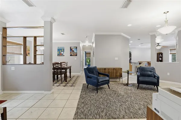a living room with furniture and a rug