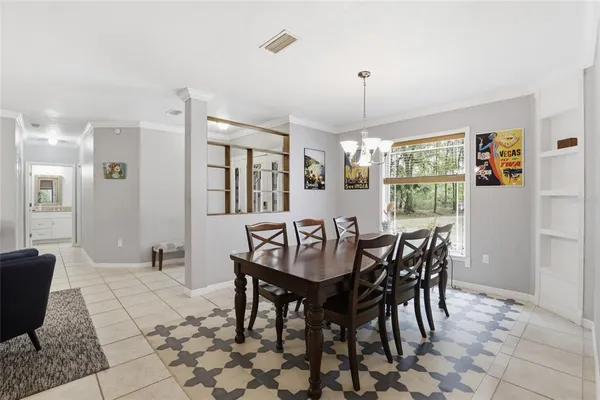 a dining room with furniture and window
