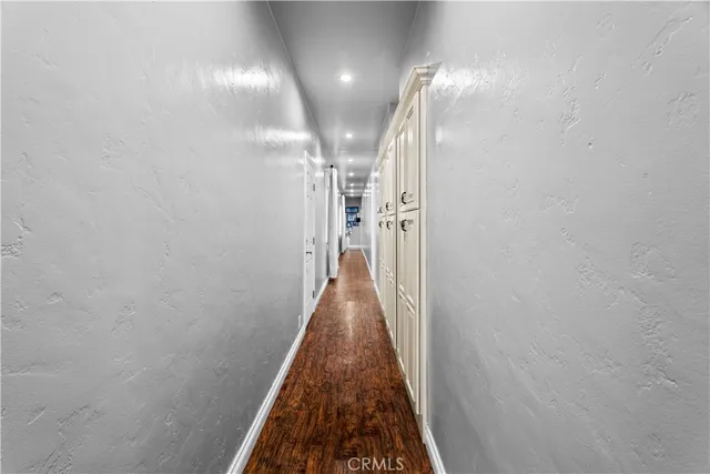 a view of a hallway with a large mirror