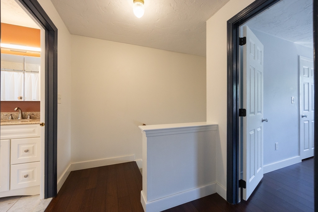 19 Cedar Square, Unit 19 Millis, MA 02054 - Photo 16 of 42 wooden floor in an empty room and a window
