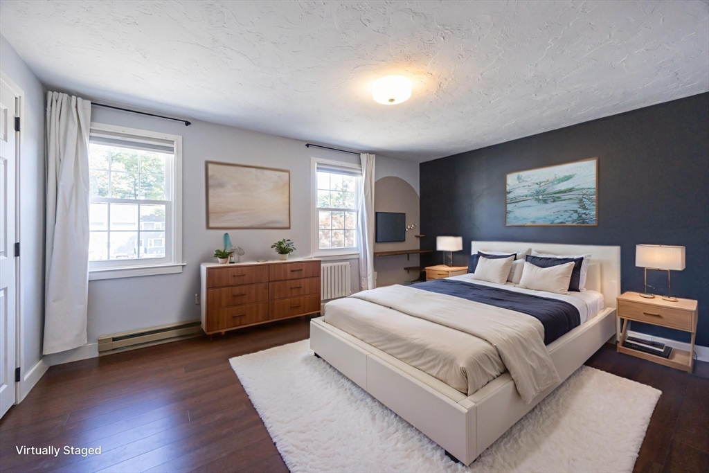 19 Cedar Square, Unit 19 Millis, MA 02054 - Photo 23 of 42 a spacious bedroom with a large bed and a window
