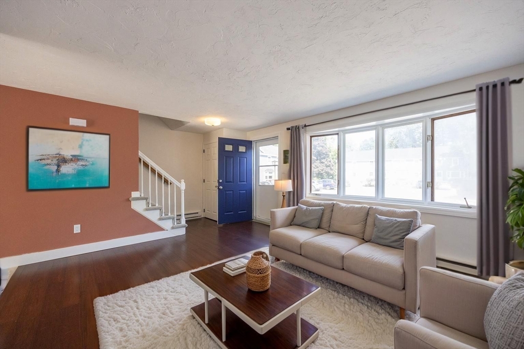 19 Cedar Square, Unit 19 Millis, MA 02054 - Photo 3 of 42 a living room with furniture and a window