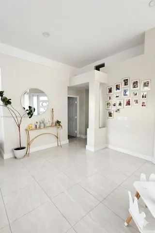 a living room with furniture and a christmas tree