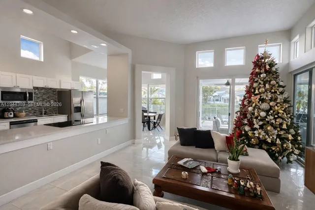a view of a deck with a big yard and a fountain