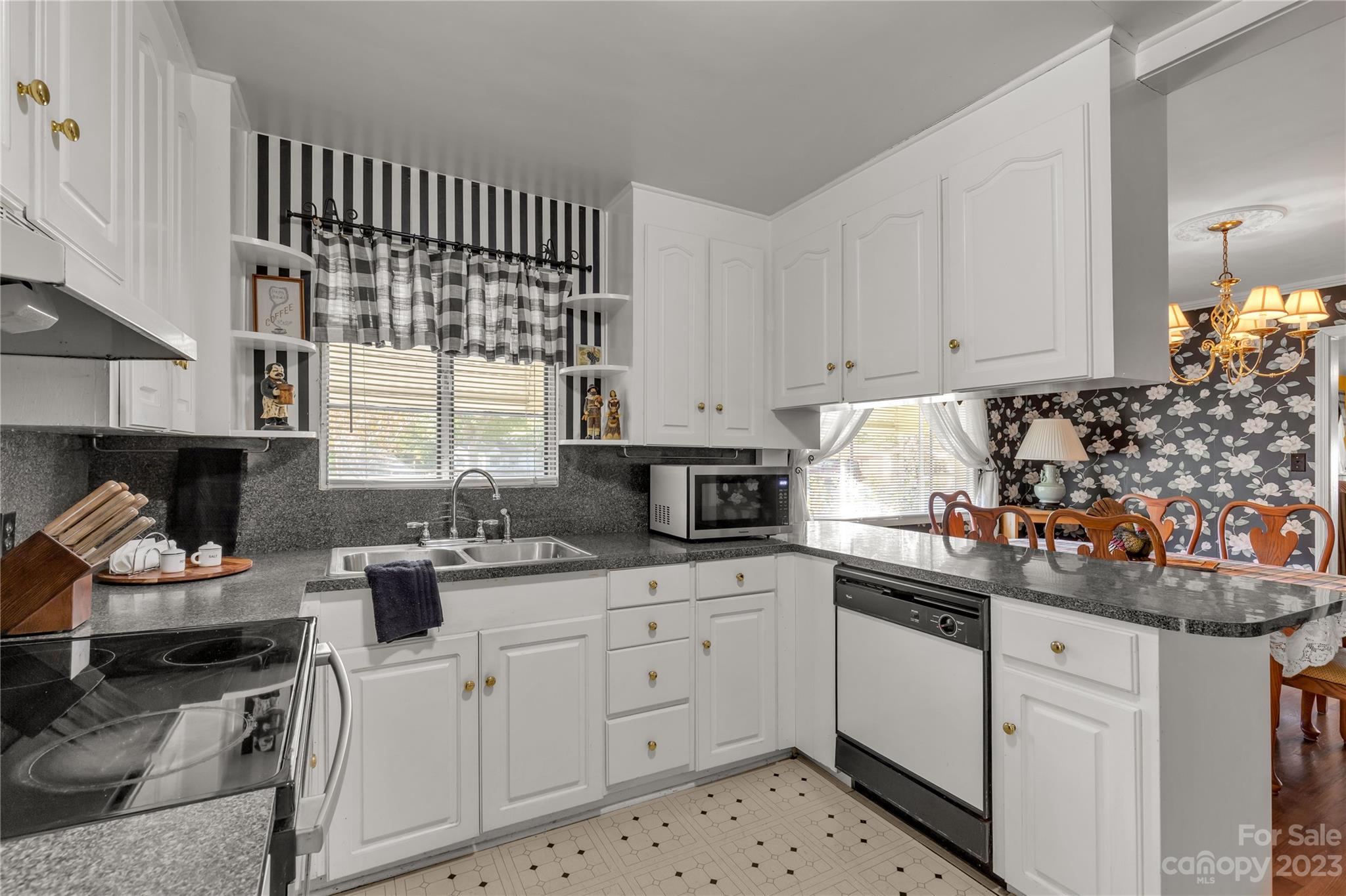 401 Gillsbrook Road Lancaster, SC 29720 - Photo 11 of 27 a kitchen with white cabinets and appliances