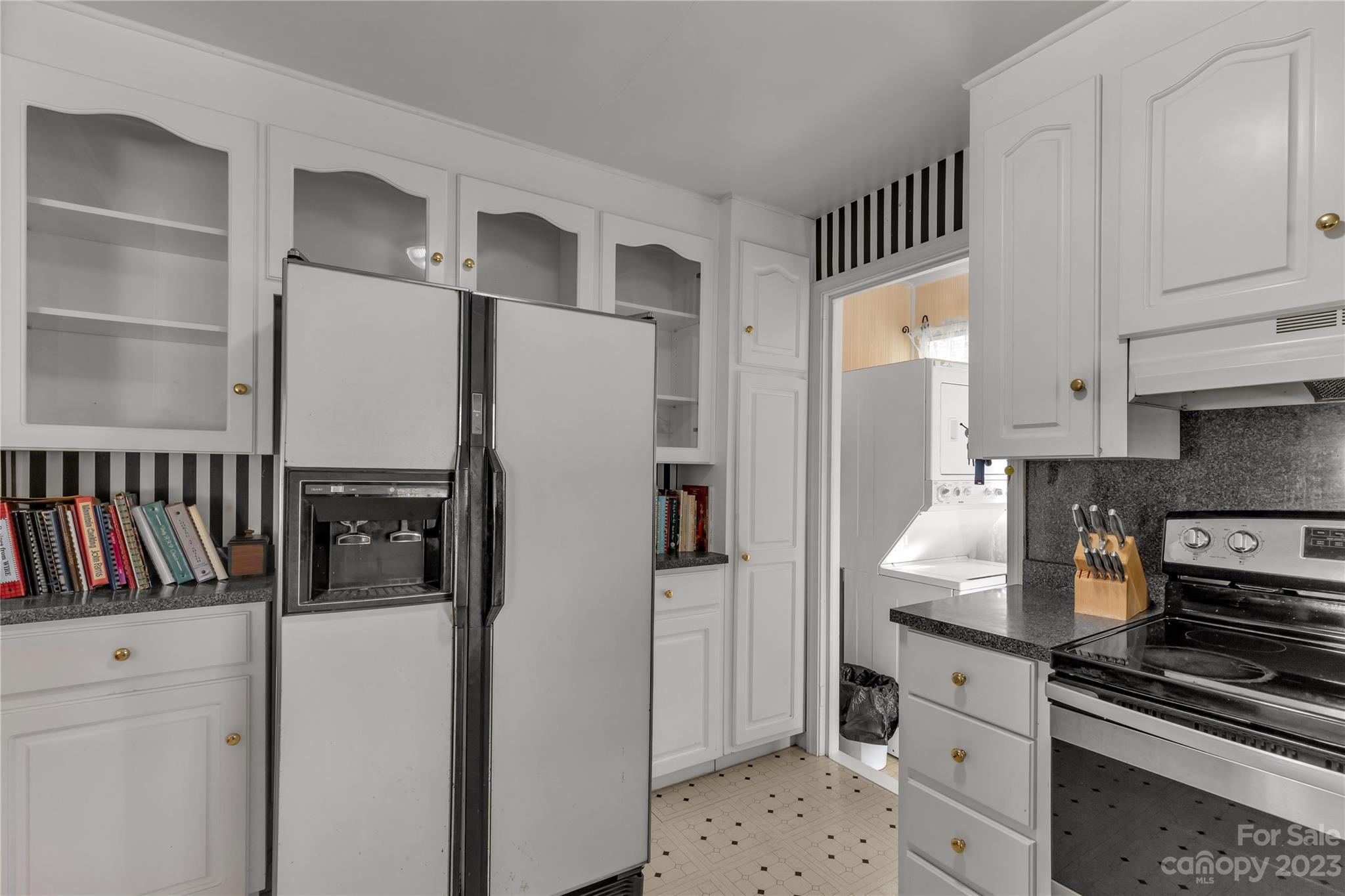 401 Gillsbrook Road Lancaster, SC 29720 - Photo 12 of 27 a kitchen with stainless steel appliances a refrigerator a stove and cabinets
