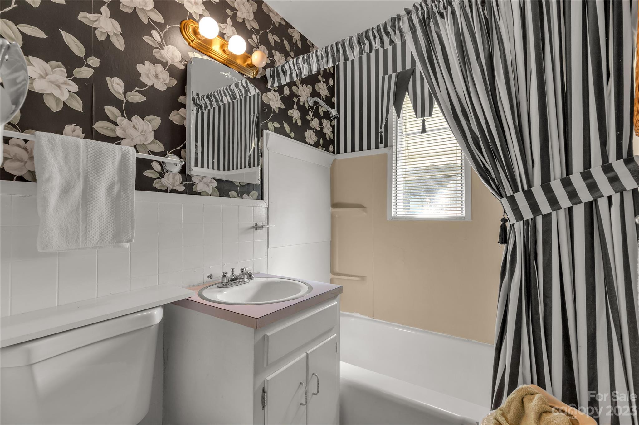 401 Gillsbrook Road Lancaster, SC 29720 - Photo 13 of 27 a bathroom with a sink toilet and shower