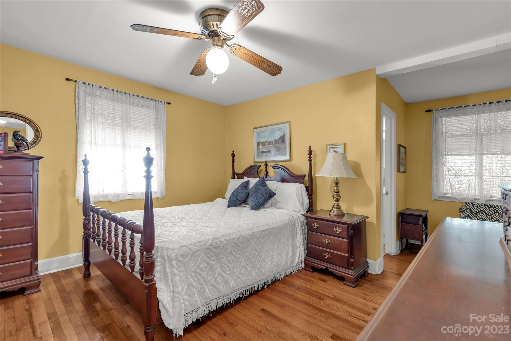401 Gillsbrook Road Lancaster, SC 29720 - Photo 18 of 27 a bedroom with a bed and wooden floor