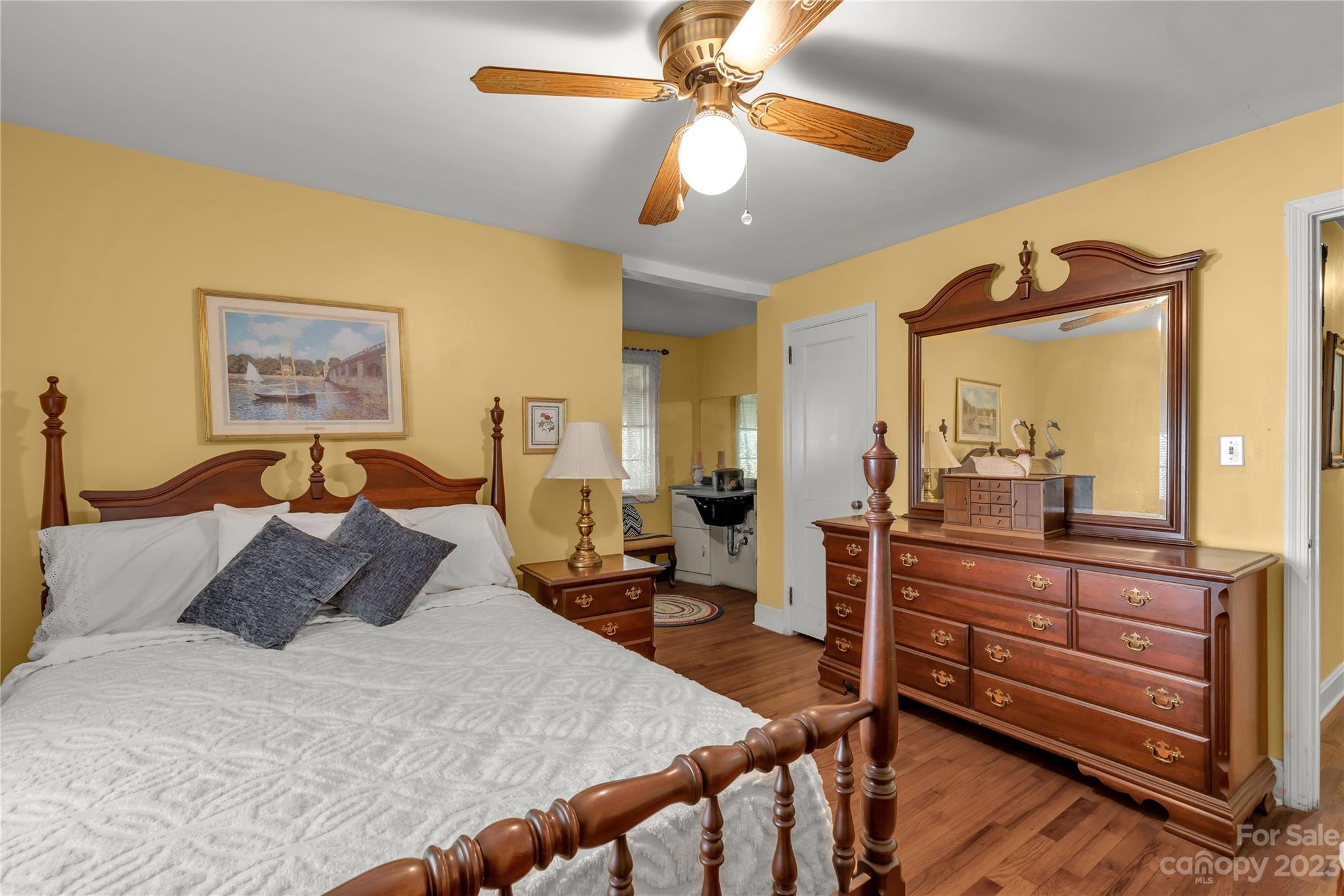 401 Gillsbrook Road Lancaster, SC 29720 - Photo 19 of 27 a bed room with a bed and a chandelier