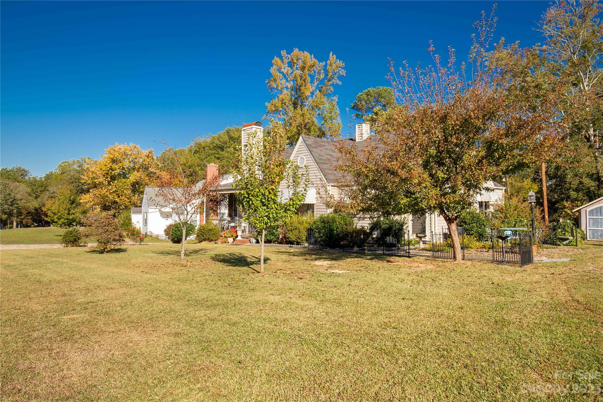 401 Gillsbrook Road Lancaster, SC 29720 - Photo 3 of 27 a backyard of apartments with large trees