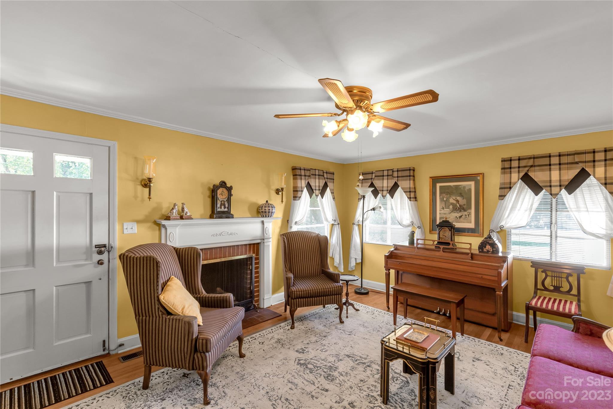 401 Gillsbrook Road Lancaster, SC 29720 - Photo 6 of 27 a living room with furniture a fireplace and a large window