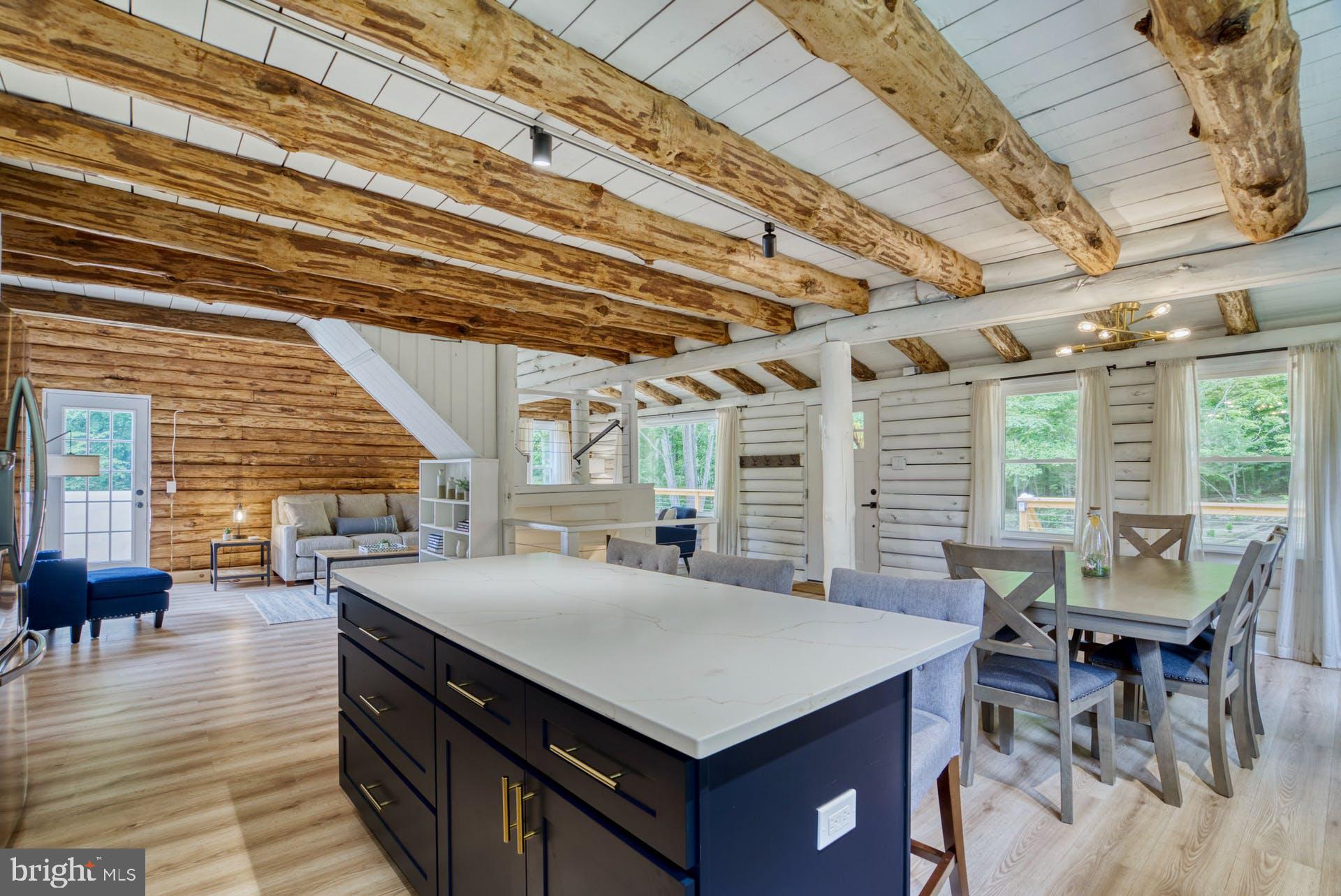 14422 Crawleys Dam Road Goldvein, VA 22720 - Photo 13 of 41 an open kitchen with a table and chairs in it