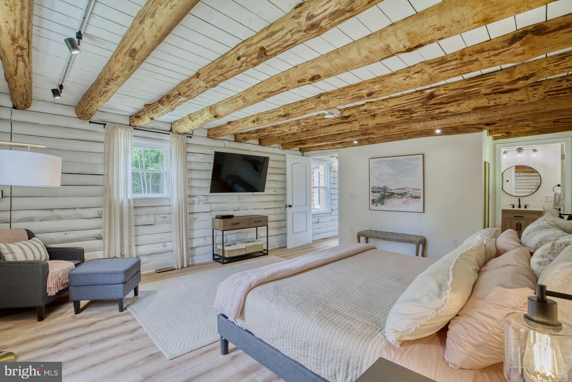 14422 Crawleys Dam Road Goldvein, VA 22720 - Photo 28 of 41 a bedroom with furniture and a flat screen tv