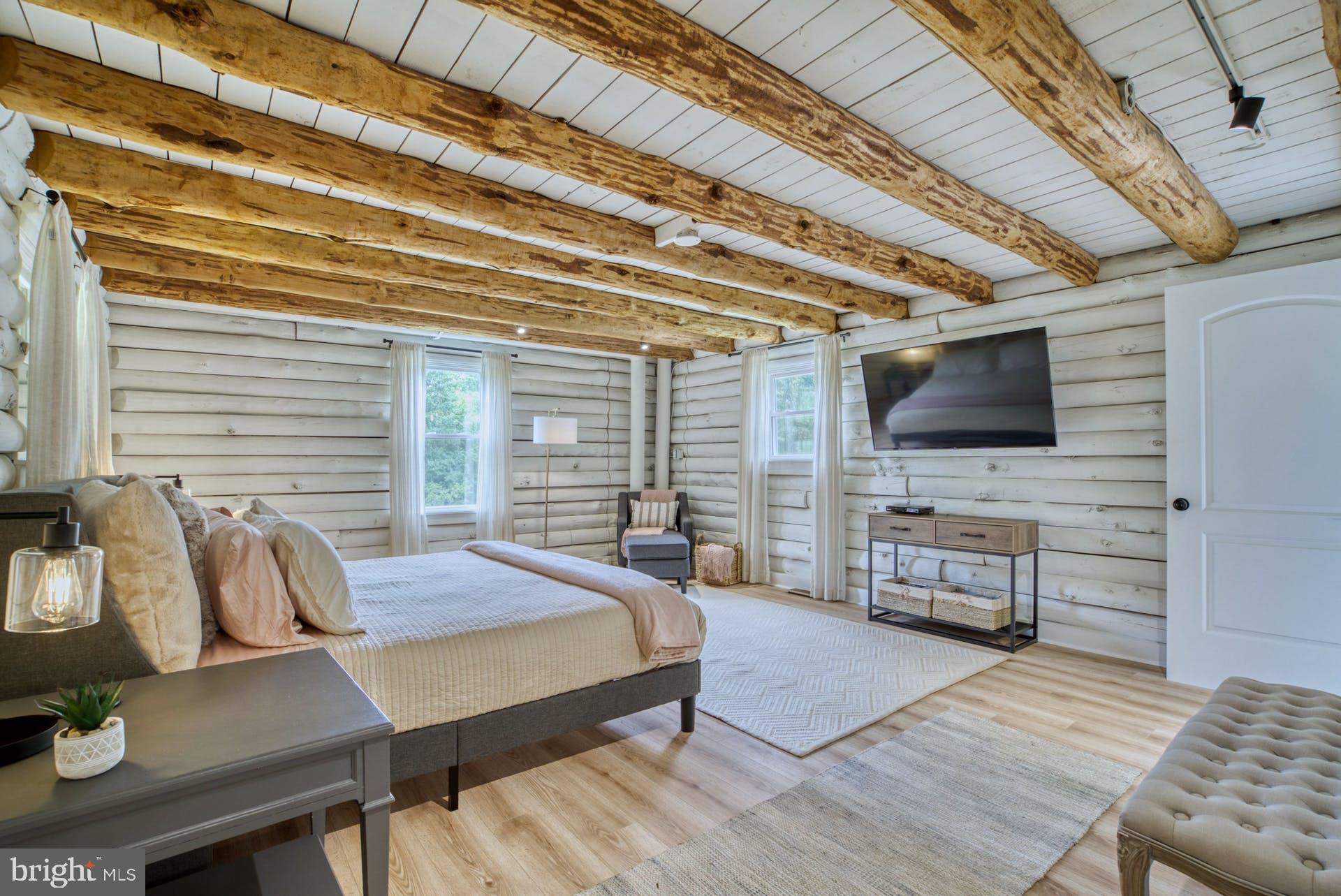 14422 Crawleys Dam Road Goldvein, VA 22720 - Photo 29 of 41 a bedroom with furniture and a flat screen tv
