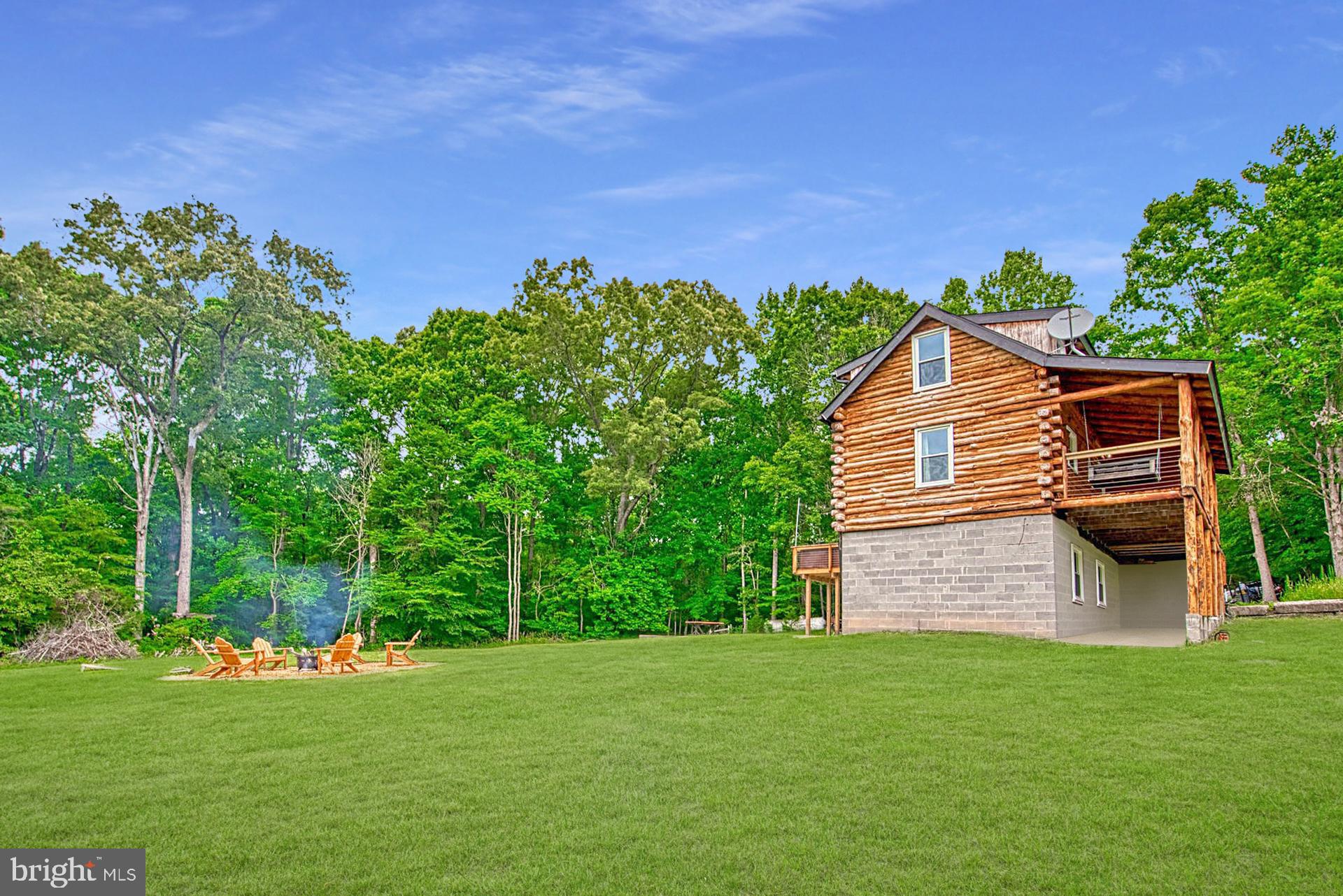 14422 Crawleys Dam Road Goldvein, VA 22720 - Photo 41 of 41 a view of a backyard with plants and a garden