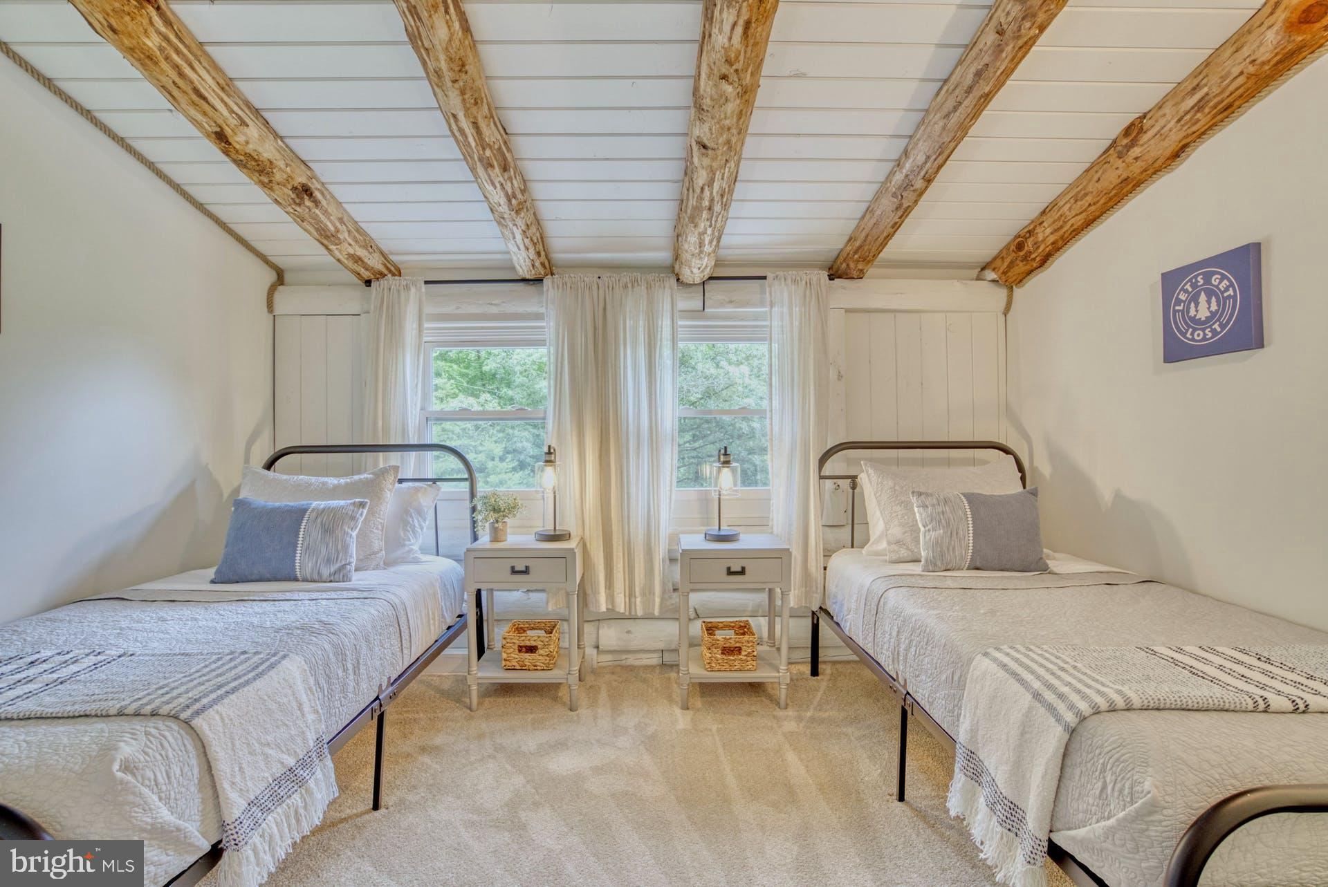 14422 Crawleys Dam Road Goldvein, VA 22720 - Photo 6 of 41 a bedroom with bed and a large window