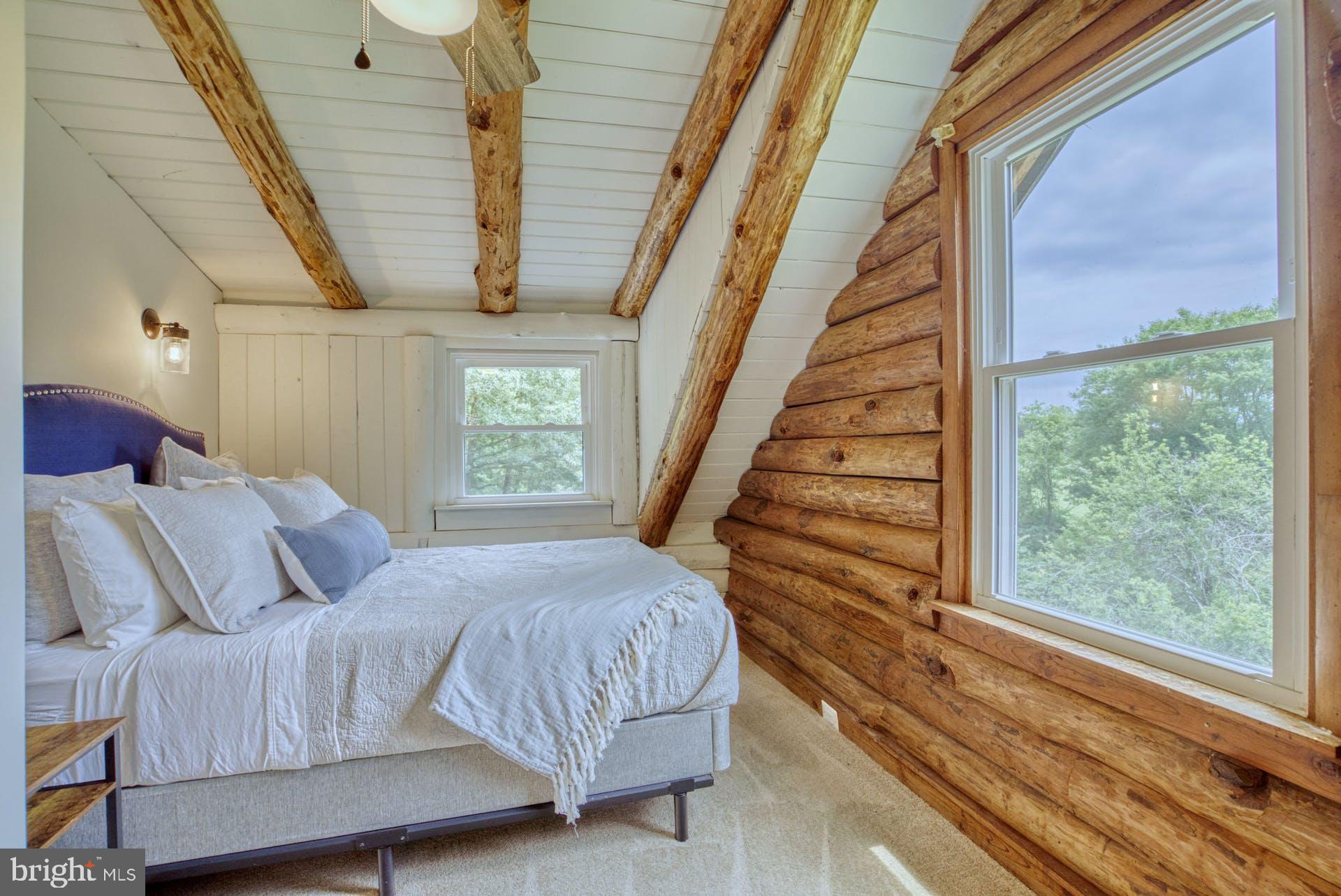 14422 Crawleys Dam Road Goldvein, VA 22720 - Photo 8 of 41 a bedroom with a bed and a window