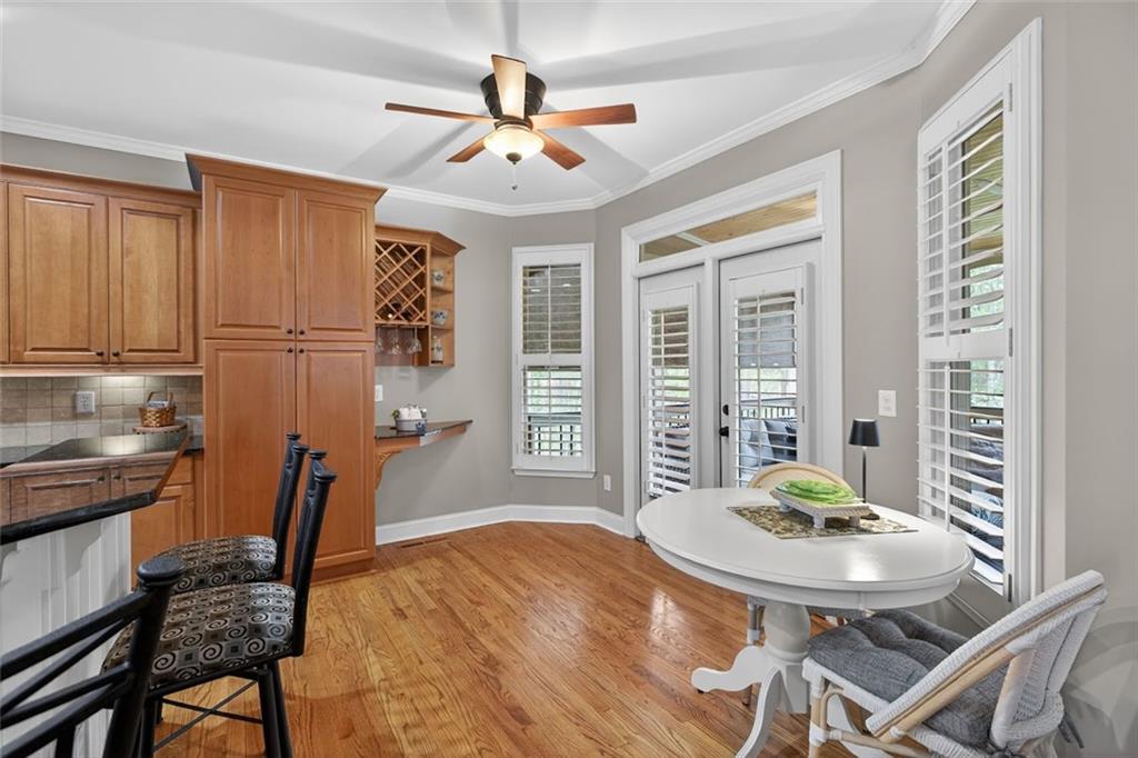 129 Dorchester Way Villa Rica, GA 30180 - Photo 17 of 65 a view of a dining room with furniture and a chandelier
