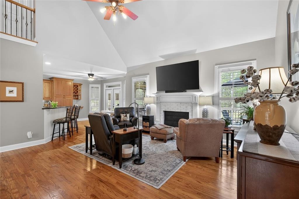 129 Dorchester Way Villa Rica, GA 30180 - Photo 20 of 65 a living room with furniture a fireplace and a flat screen tv