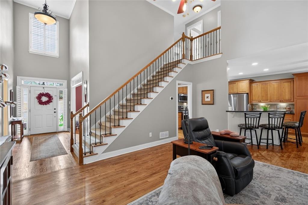 129 Dorchester Way Villa Rica, GA 30180 - Photo 21 of 65 a living room with furniture or wooden floor and a dining table