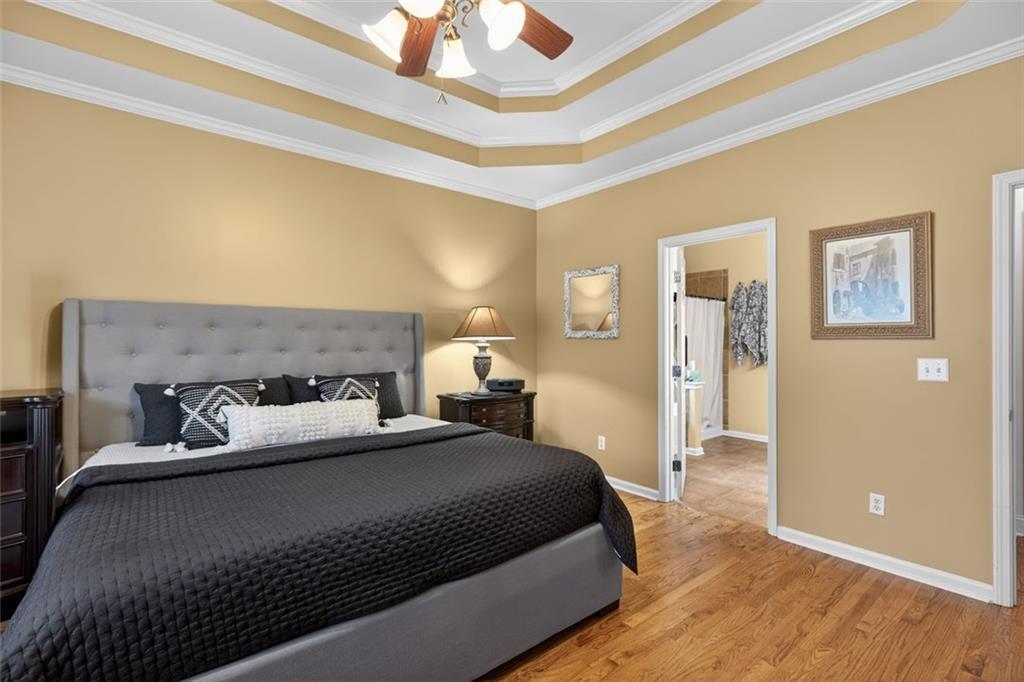 129 Dorchester Way Villa Rica, GA 30180 - Photo 22 of 65 a bedroom with bed and wooden floor