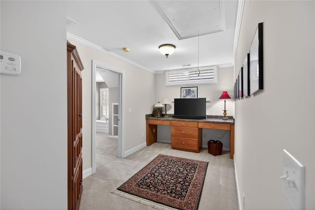 129 Dorchester Way Villa Rica, GA 30180 - Photo 30 of 65 a kitchen with stainless steel appliances granite countertop a stove a sink and a refrigerator