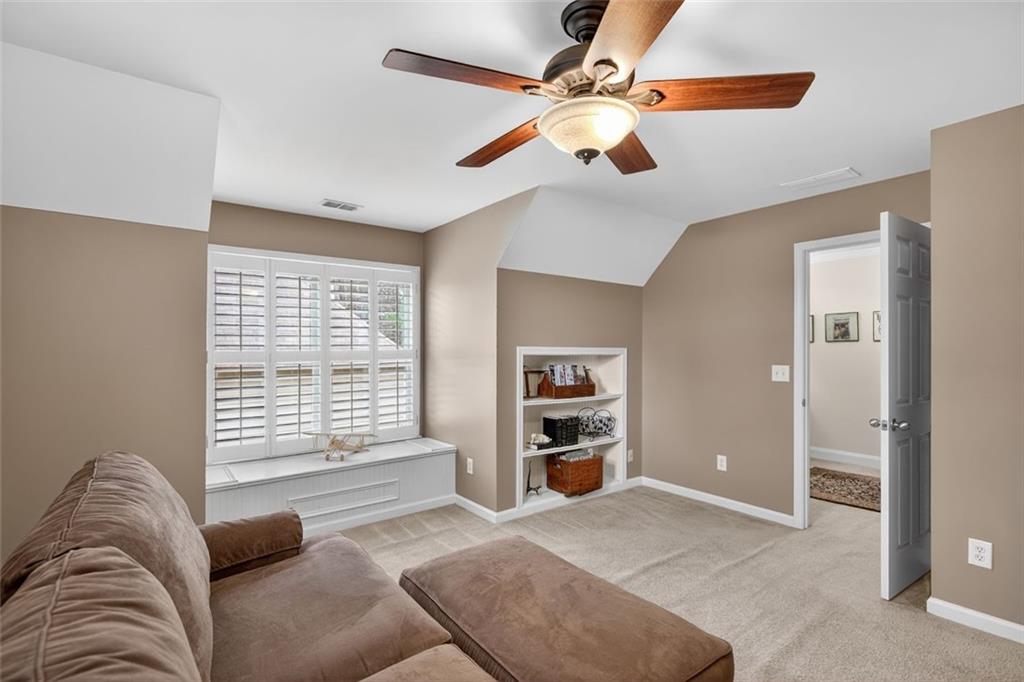 129 Dorchester Way Villa Rica, GA 30180 - Photo 33 of 65 a living room with furniture and a window