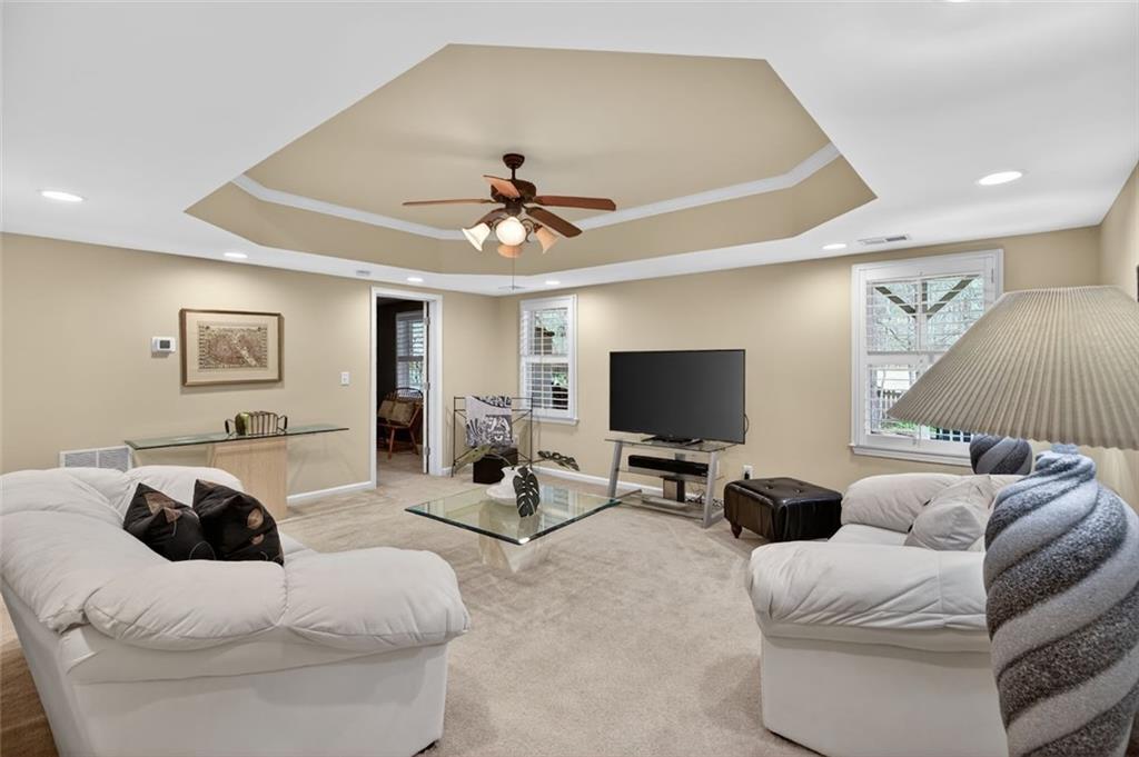 129 Dorchester Way Villa Rica, GA 30180 - Photo 35 of 65 a living room with furniture and a flat screen tv