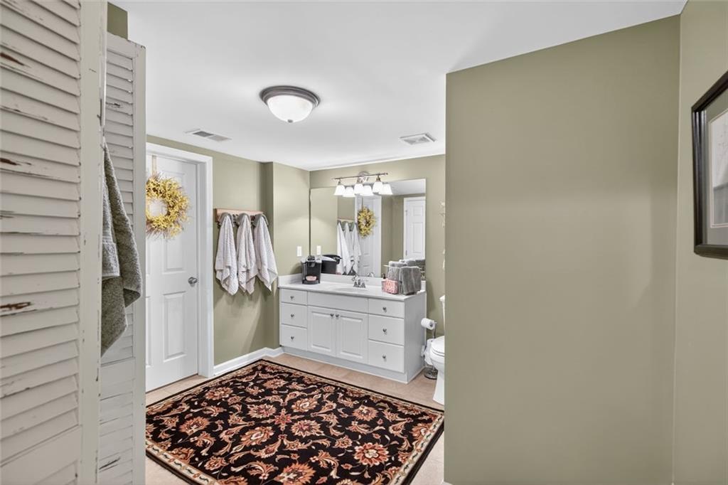 129 Dorchester Way Villa Rica, GA 30180 - Photo 37 of 65 a bathroom with a sink and a mirror