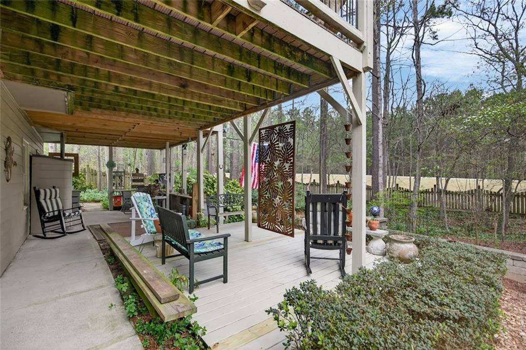 129 Dorchester Way Villa Rica, GA 30180 - Photo 48 of 65 a view of a patio with a table and chairs