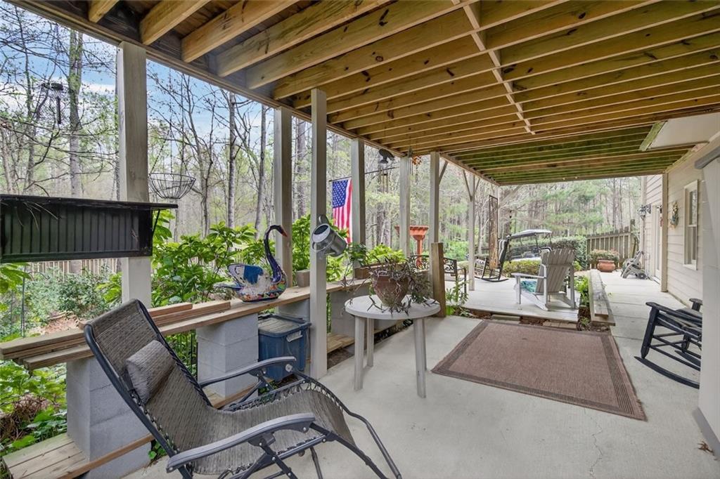 129 Dorchester Way Villa Rica, GA 30180 - Photo 49 of 65 a outdoor living space with furniture and garden view