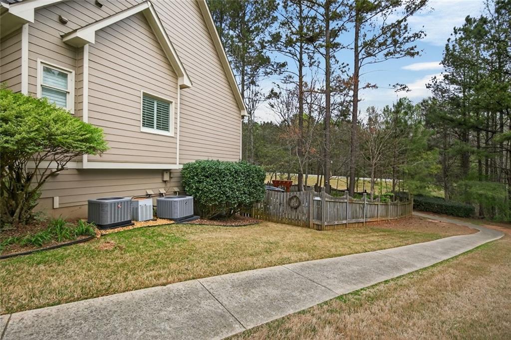 129 Dorchester Way Villa Rica, GA 30180 - Photo 54 of 65 a view of a house with backyard and sitting area