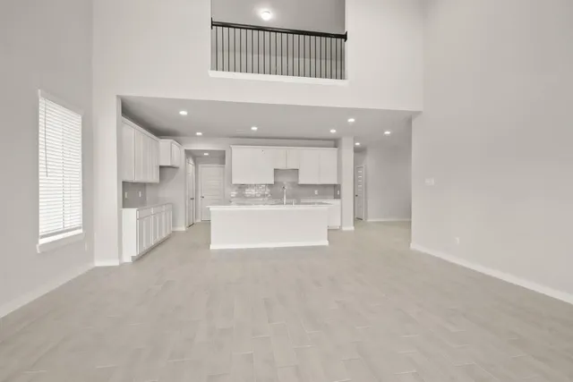 a view of a kitchen with a sink and cabinets