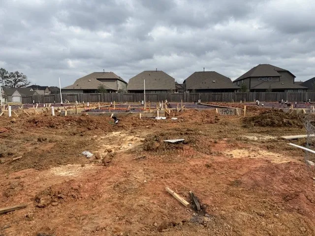 a couple of lawn chairs under an umbrella