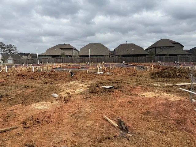 a view of house with wooden fence