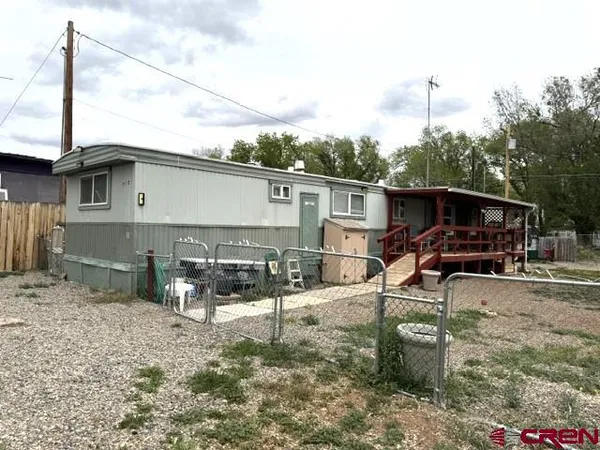 a view of house with a patio