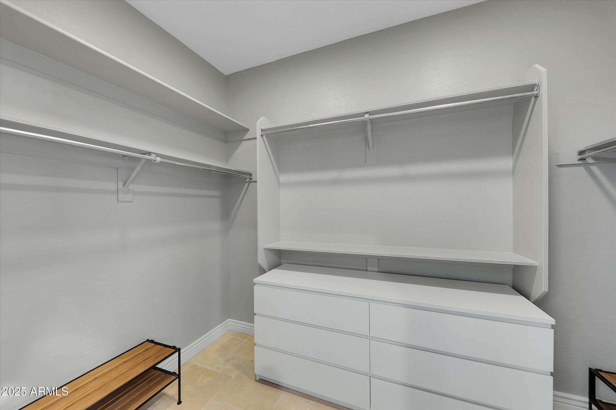 41532 North Clear Crossing Road Anthem, AZ 85086 - Photo 22 of 57 Primary closet with HIS and HER sides