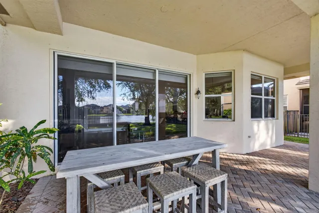 an aerial view of a house with swimming pool and garden view