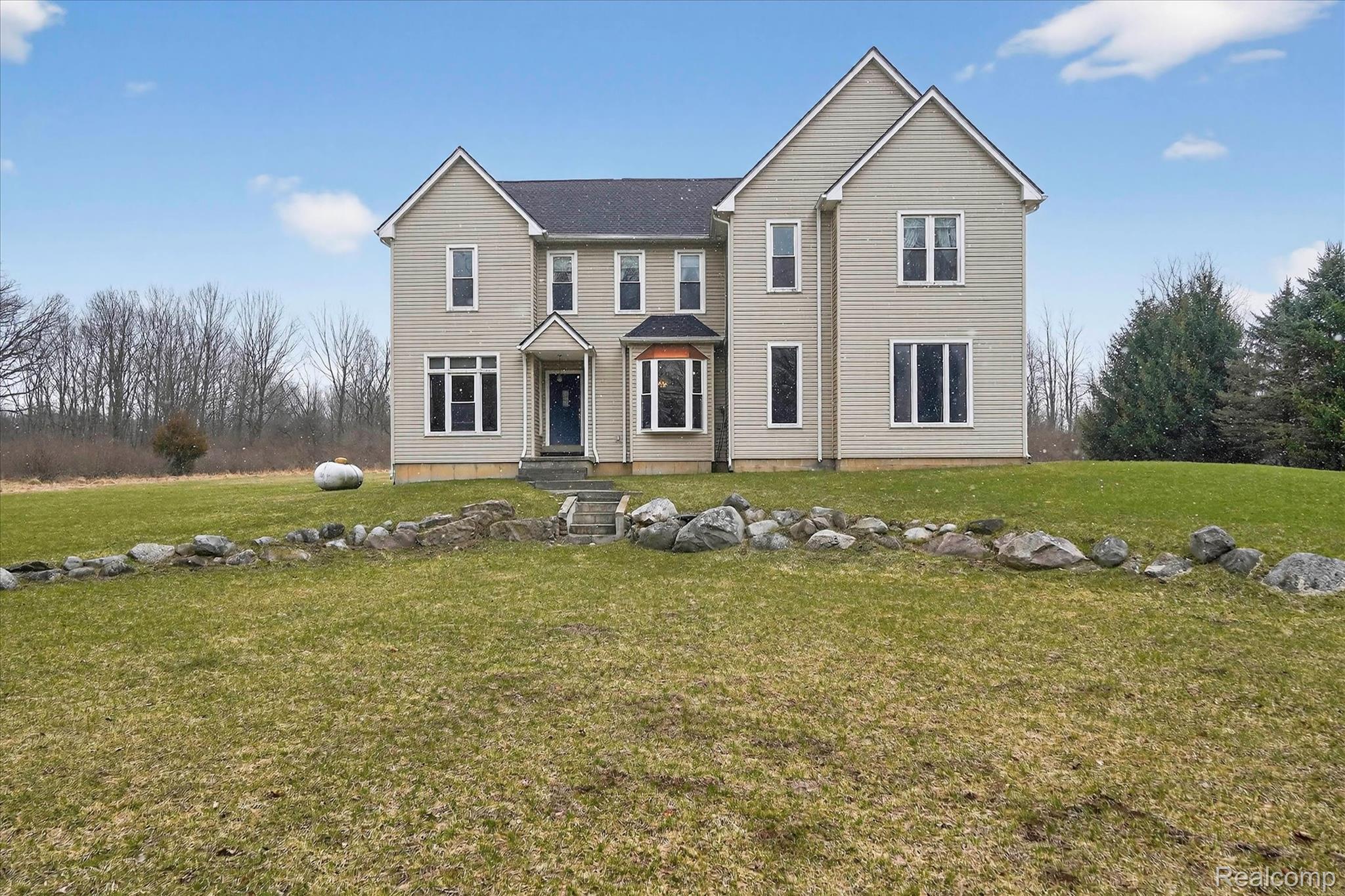 5640 Fisher Road Howell, MI 48855 - Photo 3 of 66 Traditional-style home featuring a front yard