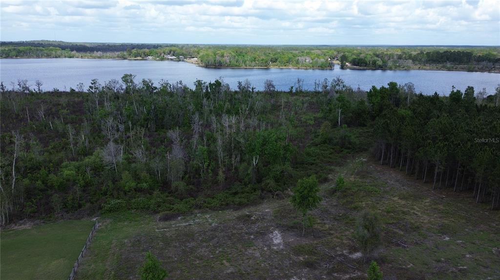 16865 Southeast 27th Place Road Ocklawaha, FL 32179 - Photo 6 of 12 a view of lake with outdoor space