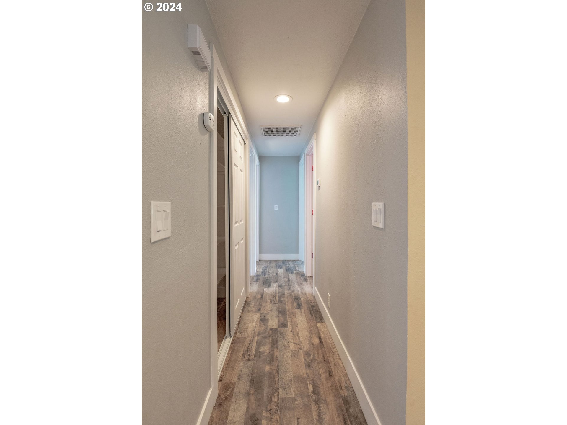 2102 Delta Street Eugene, OR 97404 - Photo 12 of 35 a view of a hallway with wooden floor