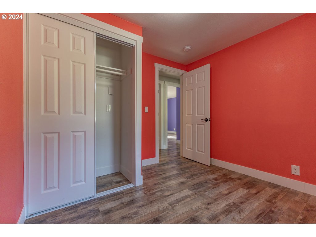 2102 Delta Street Eugene, OR 97404 - Photo 15 of 35 an empty room with wooden floor