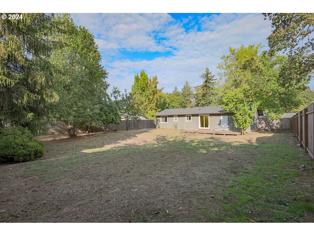2102 Delta Street Eugene, OR 97404 - Photo 29 of 35 a view of a yard in front of a house with large trees