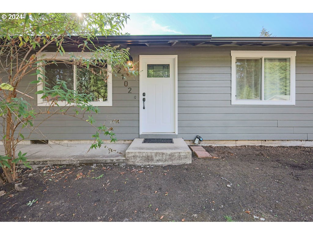 2102 Delta Street Eugene, OR 97404 - Photo 5 of 35 a front view of a house with a yard